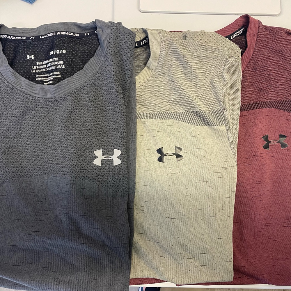 Three men’s under armor fitted seamless workout T-shirts size large